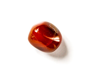 Carnelian agate gemstone on a white background