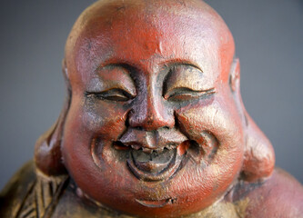 Fototapeta na wymiar Tradional wooden statue of chinese Buddha