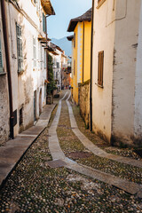 Fototapeta na wymiar Orta San Giulio / Italy - June 2021: Alley in the historic center of the village of Orta San Giulio
