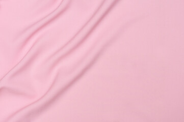 Obraz na płótnie Canvas Smooth elegant pink tissue abstract background. Textile background. Cloth wallpaper. Graphics design element