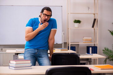 Young male student in the classroom