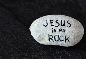 Jesus is my Rock and Salvation. Solid rock with a handwritten message. Christ is firm foundation,...