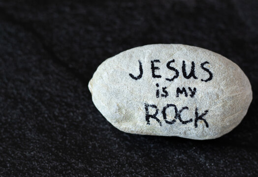 Jesus is my Rock and Salvation. Solid rock with a handwritten message. Christ is firm foundation, cornerstone on Zion. The biblical concept of trust, faith, hope in God of the Bible.