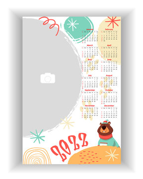 Wall Photo Calendar 2022. Colorful, baby birthday, holiday vertical photo calendar template with cute bear. Calendar design 2022 year in English. Week starts from Sunday. Vector illustration