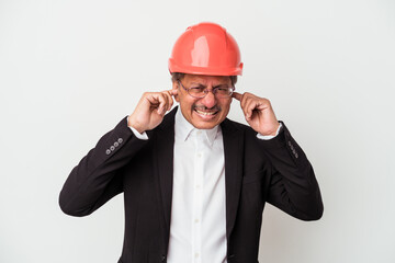 Middle aged indian architect man isolated on white background covering ears with hands.