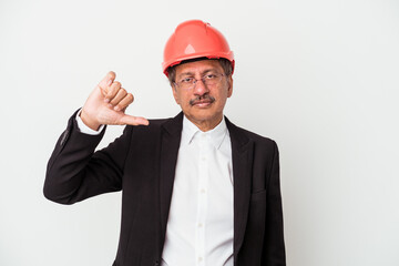 Middle aged indian architect man isolated on white background showing a dislike gesture, thumbs down. Disagreement concept.