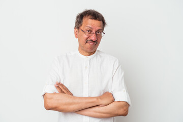 Middle aged indian man isolated on white background suspicious, uncertain, examining you.