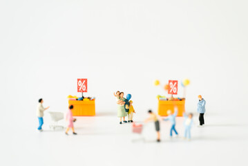 Miniature people Family Father Mother and children go shopping buying supplies supermarket mart grocery things using for internet online marketing Credit Card spending money department store business