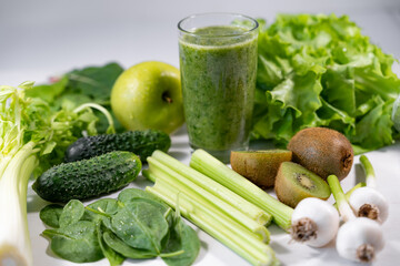 glass of green vegetable juice.
