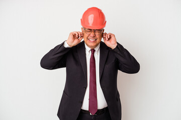 Senior american arquitech man isolated on white background covering ears with hands.