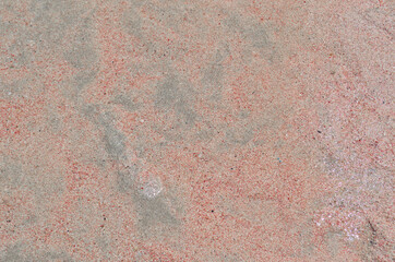 White and pink sand as an abstract colored summer background.