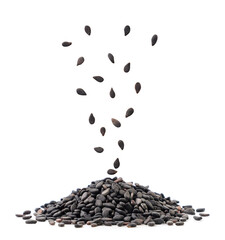 Black sesame seeds fall on a heap on a white background, levitating sesame seeds. Isolated