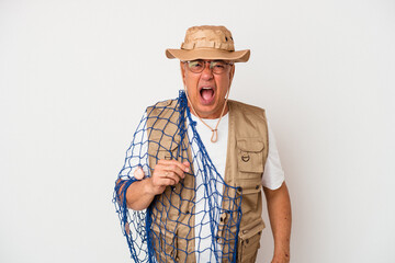 Senior american fisherman holding net isolated on white background screaming very angry and aggressive.
