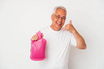 Senior american man holding a hot water bottle isolated on white background showing a mobile phone...