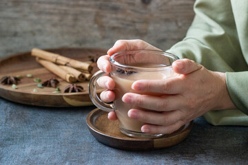 Masala tea served on a plate with spices
