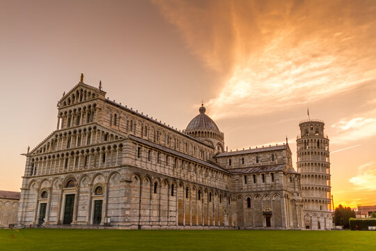 Pisa's Cathedral and the leaning tower of Pisa at sunrise taken across the Piazza dei Miracoli (Square of Miracles), Pisa, Tuscany, Italy