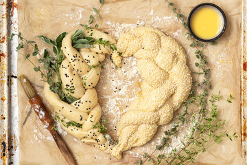 Cooking baking concept. Making rustic  challah bread  with herbs