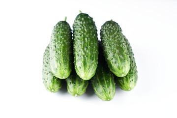 Set of fresh whole cucumbers isolated on a white background, clipping path. Garden cucumber wallpaper backdrop design