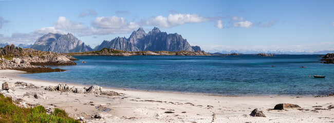 Beautiful picturesque Scandinavia panorama of a wide sandy beach on the shore of the blue calm bay...