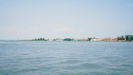 Island of Murano over water surfac, Venice, Italy