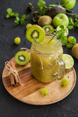 Healthy smoothie of fresh green fruits. Creative atmospheric decoration