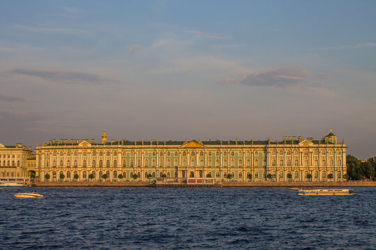 panoramic view of the Hermitage Winter Palace-Museum and the Neva River at sunset on a sunny summer evening and a copy space in Saint-Petersburg Russia