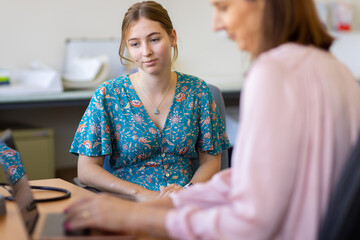 young female at medical appointment in doctors surgery