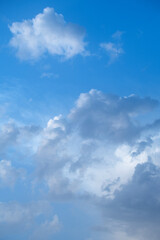 Fototapeta premium Majestic skies and clouds on a summer day near the coast. Blue vector clouds with sky texture