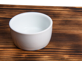 Fototapeta na wymiar Empty white dish on dark wooden desk