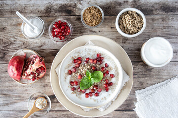 Close-up of a bowl of millet semolina with pomegranate seeds