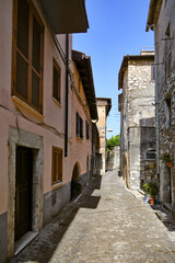 Fototapeta na wymiar An alley in the medieval quarter of Maenza, a medieval town in the Lazio region. Italy.