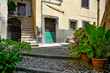 Fototapeta na wymiar Maenza, Italy, July 24, 2021. A street in the historic center of a medieval town in the Lazio region.