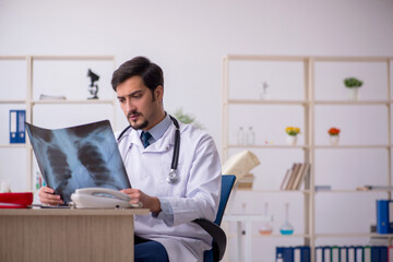 Young male doctor radiologist working in the clinic