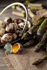 Raw asparagus and quail eggs.