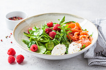 Summer salad with salted salmon, ricotta and raspberries.