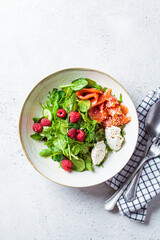 Summer salad with salted salmon, ricotta and raspberries.