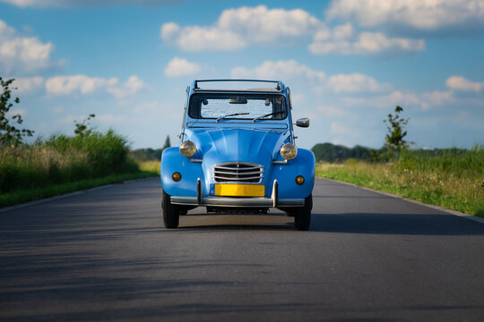 ZOETERMEER, NETHERLANDS - Jul 15, 2021: Blue Citroen 2CV (Deux Chevaux) classic car on the road