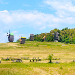 Obraz premium Old wooden windmills in the open-air museum. Ukraine.