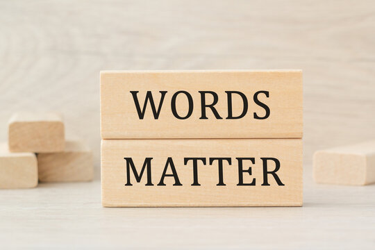 the word WORDS MATTER is written on a wooden cubes structure. Can be used for business, MEDICINE, financial concept. Selective focus.