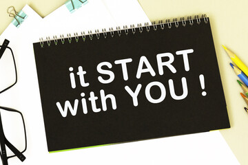 IT START WITH YOU . Office supplies, alarm clock, block with text. Business, education concept. flat lay