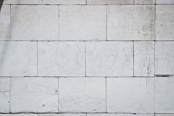 Abstract background of white cement blocks. Marble white brick texture.