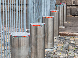 Metal mobile fences and automatic retractable bollards