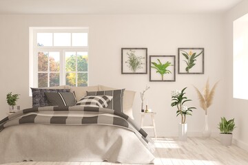 White stylish minimalist bedroom with autumn landscape in window. Scandinavian interior design. 3D illustration