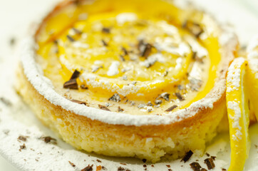 Tarte au Citron deliciously rich and zingy lemon creme encased in crumbly, buttery pastry case gently baked to perfectly complement the creamy filling