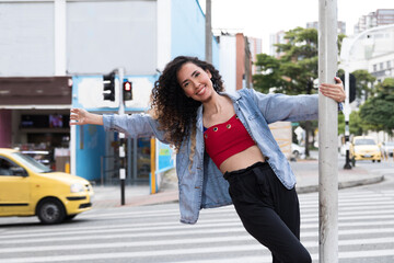 Latin lady walking through the city