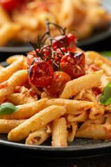 Baked sweet cherry tomatoes and Greek feta cheese fussily pasta. Trendy Vegetarian food