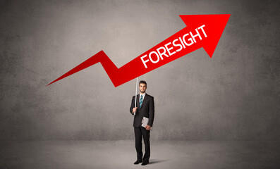 Fototapeta premium Young business person in casual holding road sign