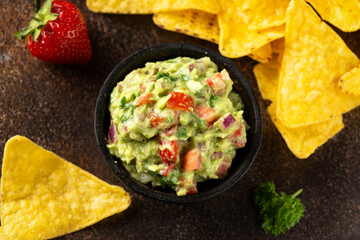 Strawberry and avocado guacamole, salsa with crispy tortilla chips