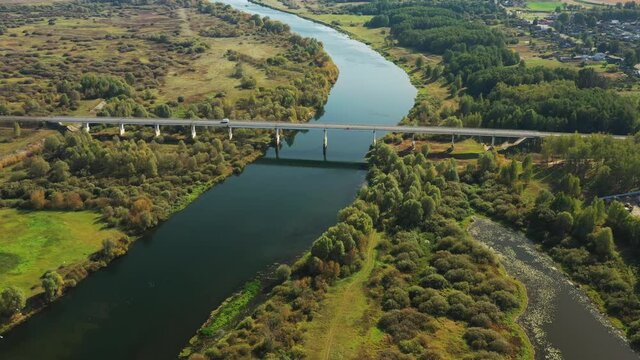 Chachersk, Belarus. Aerial View Of Bridge over the Sozh river In Summer Day. Top View Of Beautiful European Nature From High Attitude In Summer Season. Drone View. Bird's Eye View