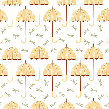Vector seamless pattern with open umbrellas and dragonflies. 